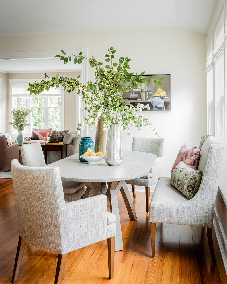 Inspiration for a small traditional dining room in Boston with white walls, medium hardwood floors and no fireplace.