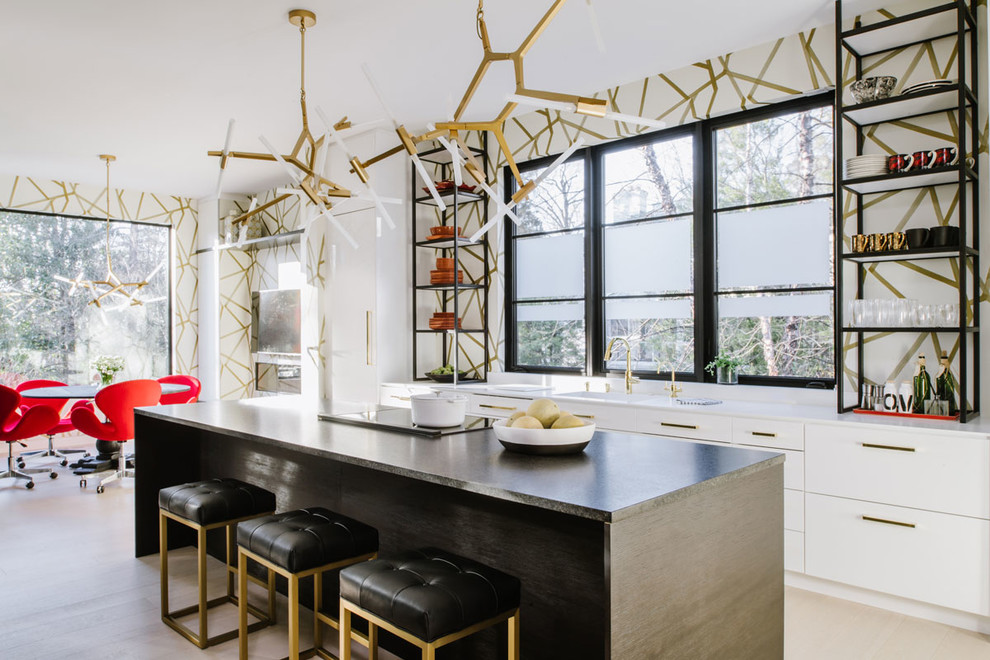 Large contemporary galley eat-in kitchen in DC Metro with a drop-in sink, flat-panel cabinets, white cabinets, quartzite benchtops, multi-coloured splashback, white appliances, light hardwood floors, with island and white floor.