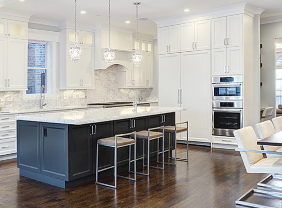 Inspiration for a large transitional l-shaped dark wood floor eat-in kitchen remodel in Chicago with an undermount sink, recessed-panel cabinets, white cabinets, marble countertops, stone slab backsplash, paneled appliances and an island