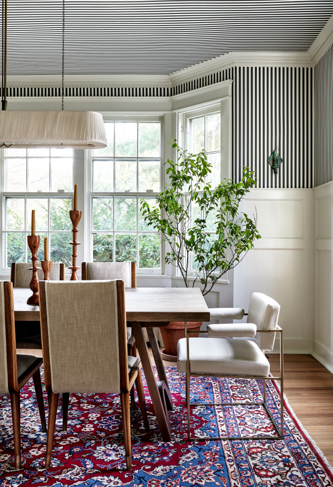 Design ideas for a transitional dining room in DC Metro with wallpaper and wallpaper.