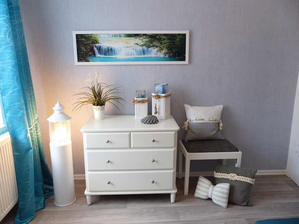 This is an example of a small beach style guest bedroom in Leipzig with grey walls, linoleum floors, no fireplace and grey floor.