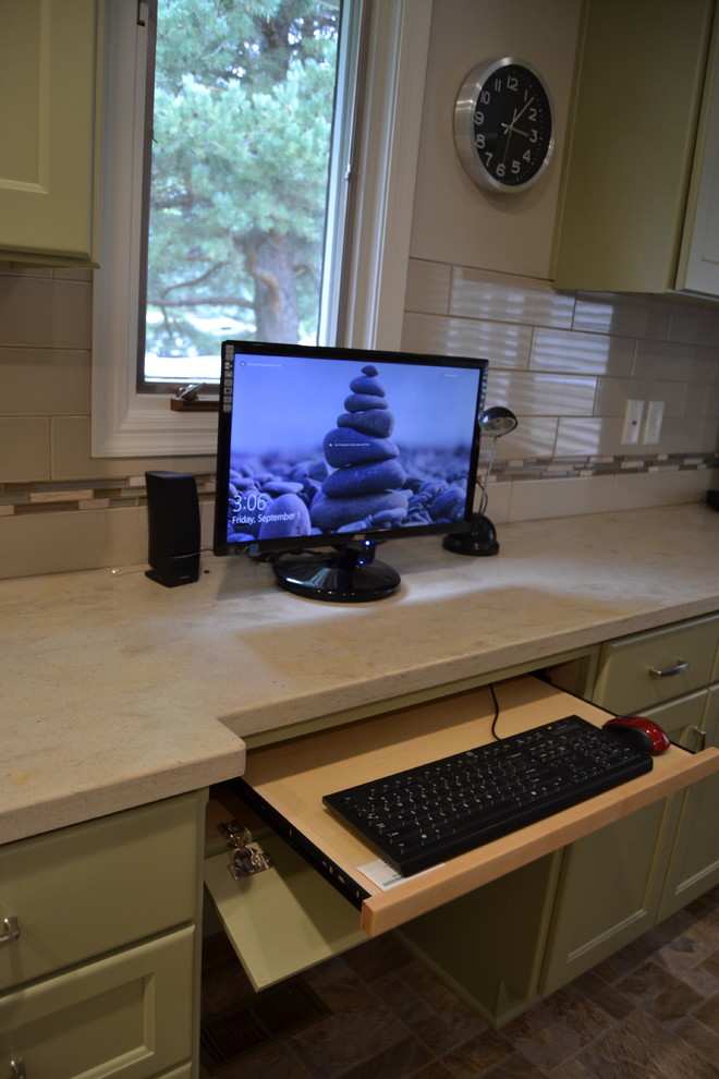 Example of a mid-sized transitional l-shaped ceramic tile and beige floor eat-in kitchen design with shaker cabinets, green cabinets, white backsplash, subway tile backsplash and no island