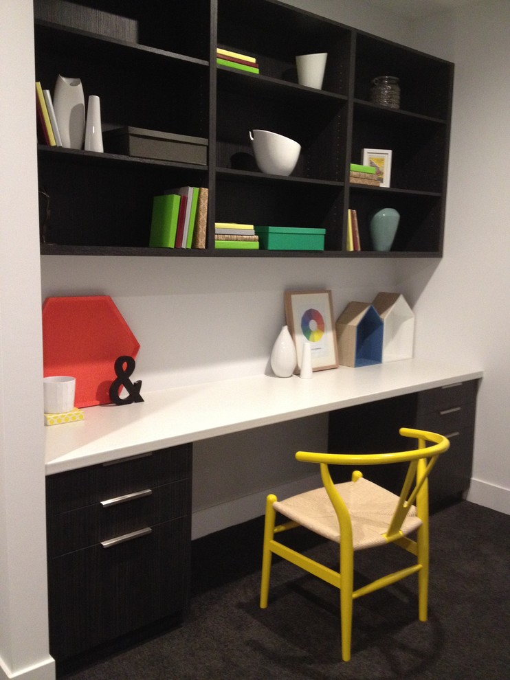 Inspiration for a small contemporary study room in Melbourne with white walls, carpet and a built-in desk.