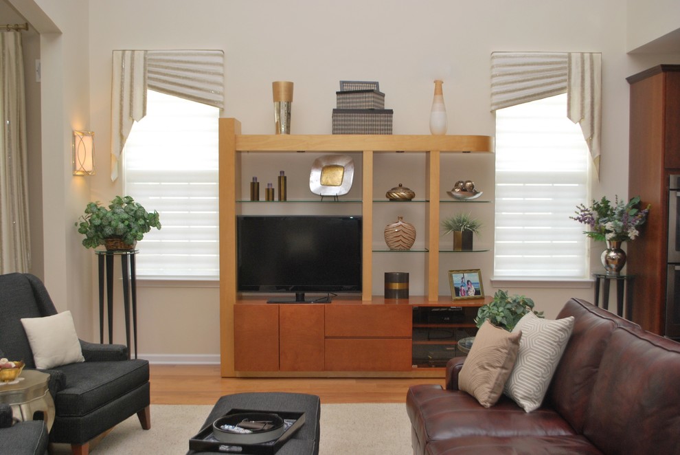Example of a transitional medium tone wood floor home design design in New York with beige walls