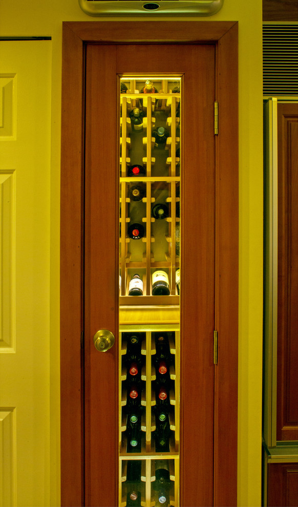 Small traditional wine cellar in Vancouver with storage racks.