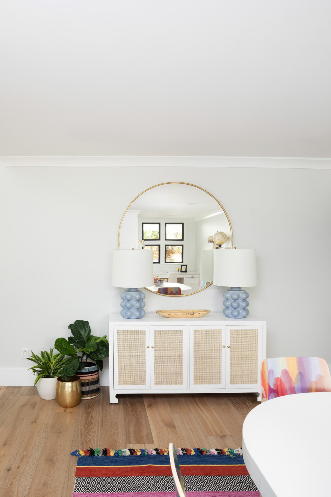 Inspiration for a mid-sized country gender-neutral kids' study room for kids 4-10 years old in Orange County with white walls, light hardwood floors and beige floor.