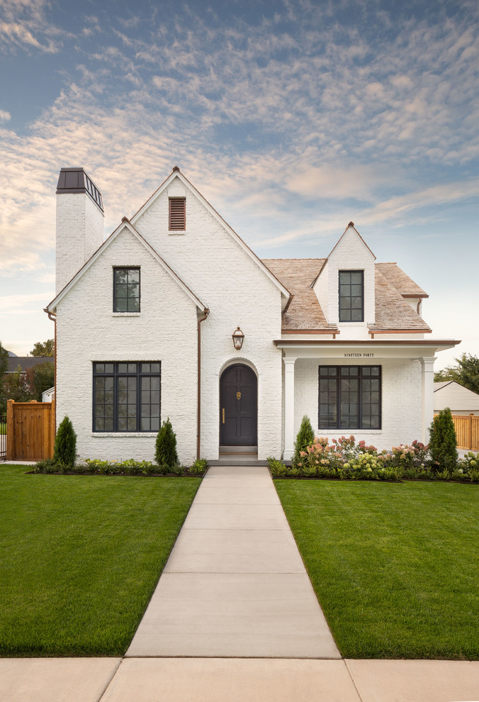 Design ideas for a traditional two-storey white house exterior in Salt Lake City with a gable roof and a shingle roof.