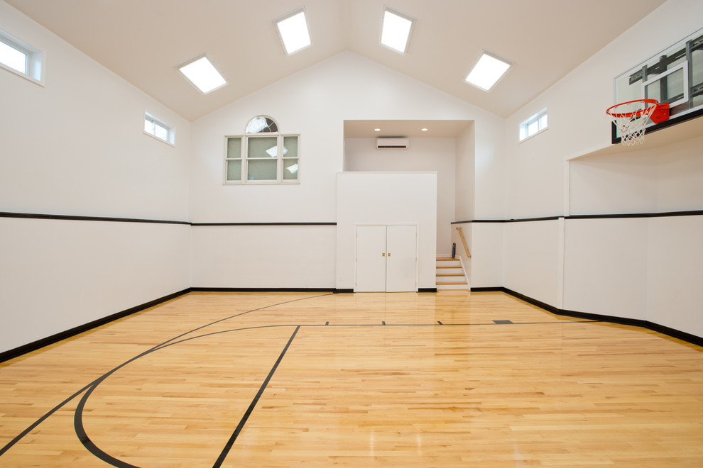 Inspiration for a traditional indoor sport court in Philadelphia with white walls and light hardwood floors.
