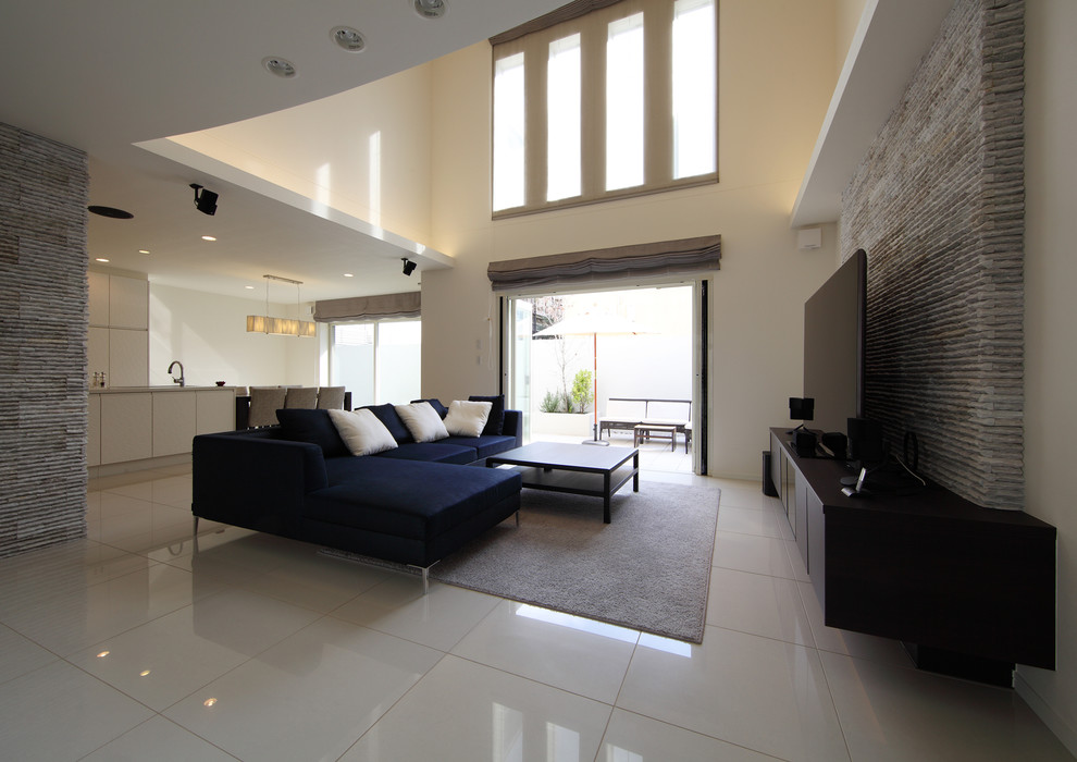 Photo of a large modern formal open concept living room in Yokohama with white walls, ceramic floors, a freestanding tv and white floor.