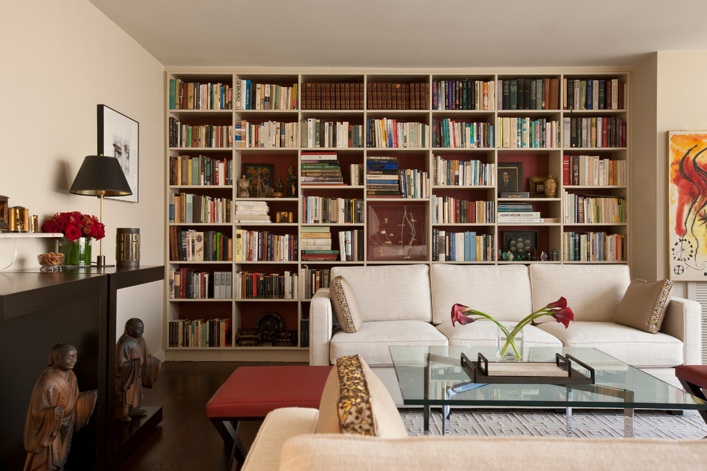 Inspiration for a large transitional enclosed living room in Chicago with a library, beige walls, dark hardwood floors, no fireplace and no tv.