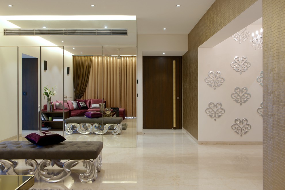 This is an example of a large contemporary open concept living room in Mumbai with marble floors.