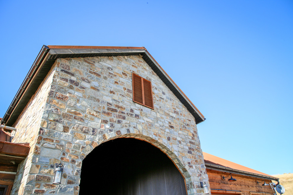 Mountain style home design photo in Calgary