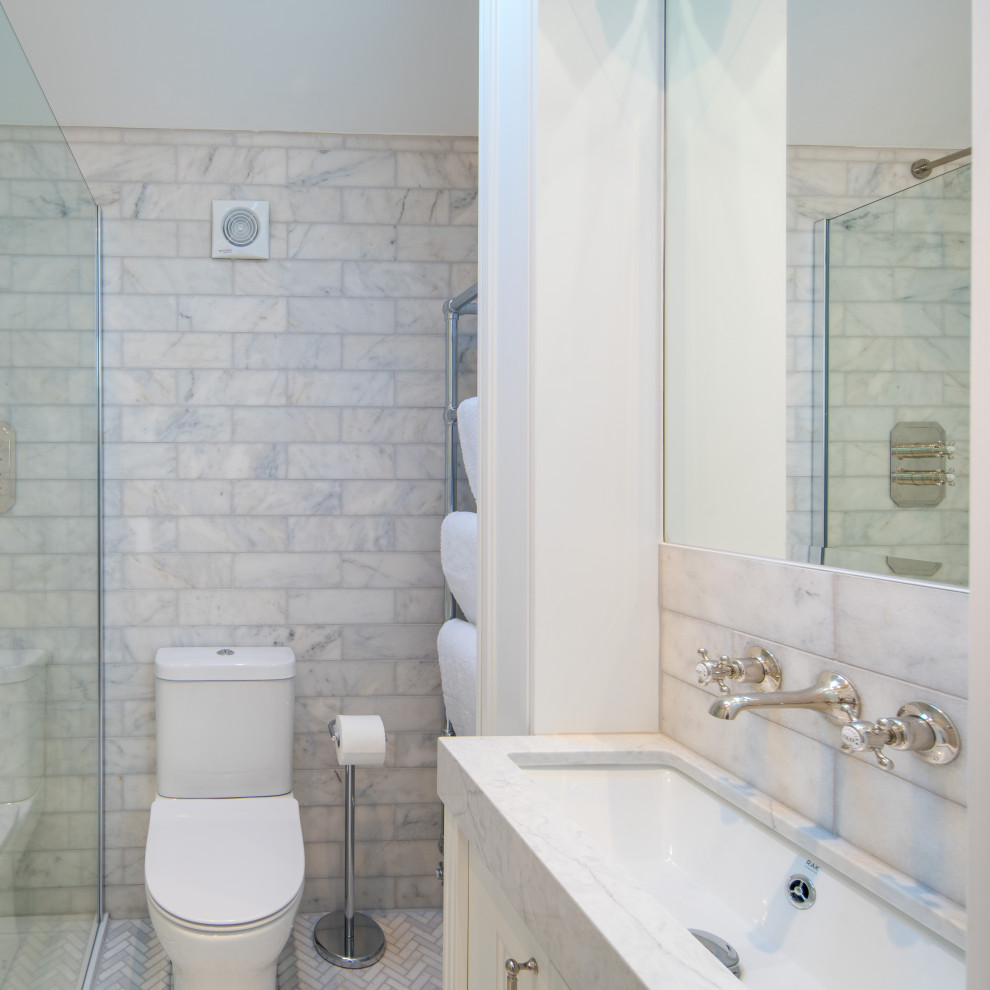 Photo of a small beach style ensuite bathroom in Other with shaker cabinets, white cabinets, a walk-in shower, white tiles, marble tiles, white walls, marble flooring, quartz worktops, white floors, an open shower, white worktops, a single sink, a built in vanity unit and a vaulted ceiling.