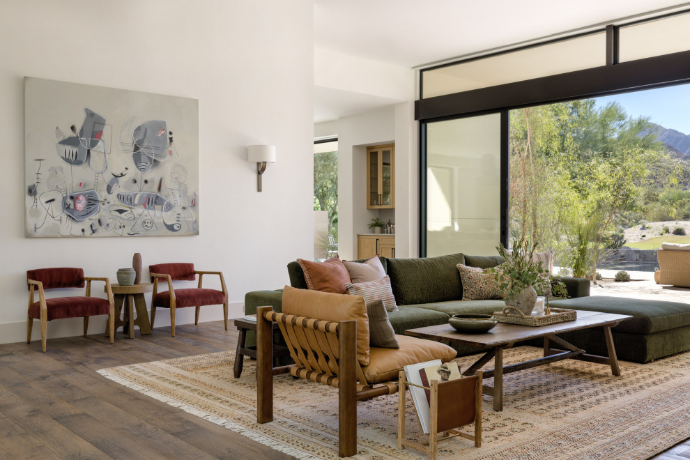 Living room - huge southwestern open concept medium tone wood floor and brown floor living room idea in Seattle with white walls, a standard fireplace and a tile fireplace