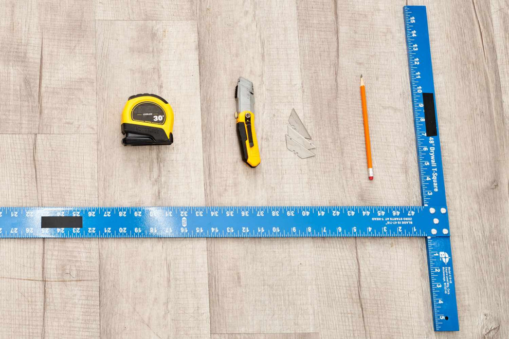 measuring and cutting drywall