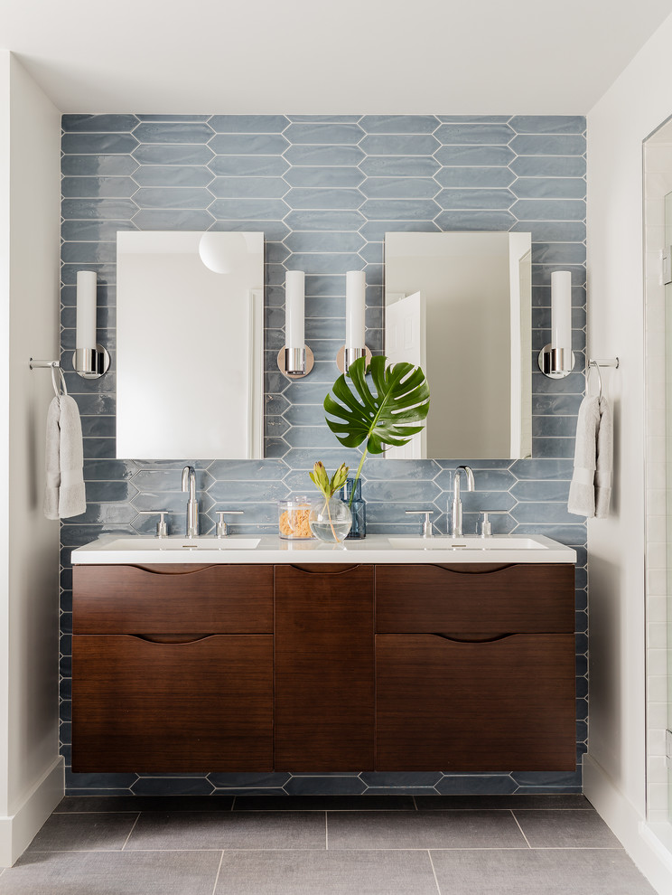 Design ideas for a contemporary master bathroom in Boston with flat-panel cabinets, dark wood cabinets, a freestanding tub, an alcove shower, blue tile and grey floor.