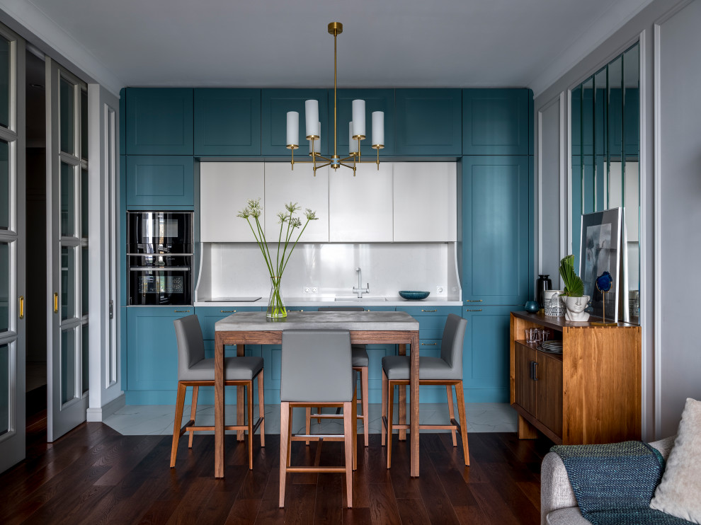 Mid-sized transitional single-wall open plan kitchen in Moscow with an undermount sink, turquoise cabinets, quartz benchtops, white splashback, panelled appliances, porcelain floors, no island, white floor, white benchtop, shaker cabinets and stone slab splashback.