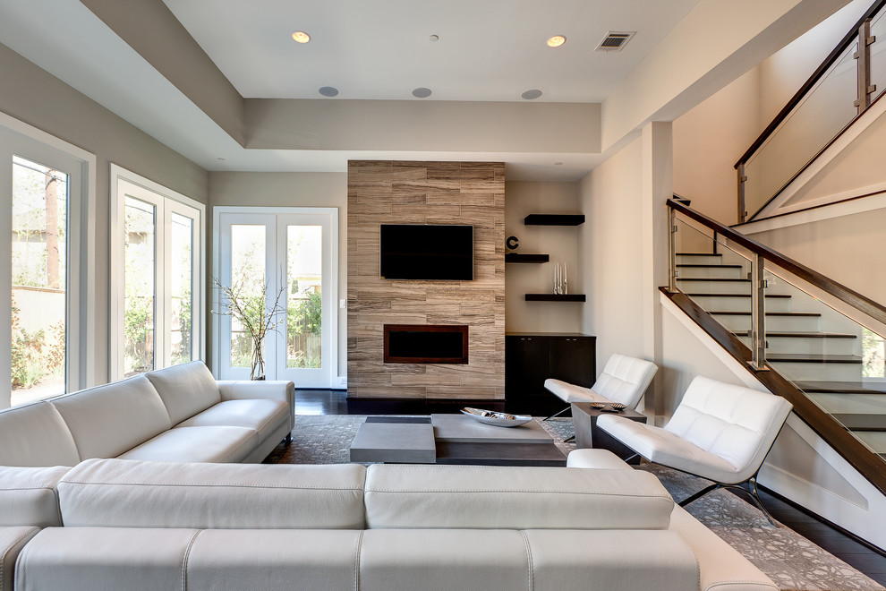 Inspiration for a mid-sized contemporary formal open concept living room in Houston with a ribbon fireplace, a wall-mounted tv and dark hardwood floors.