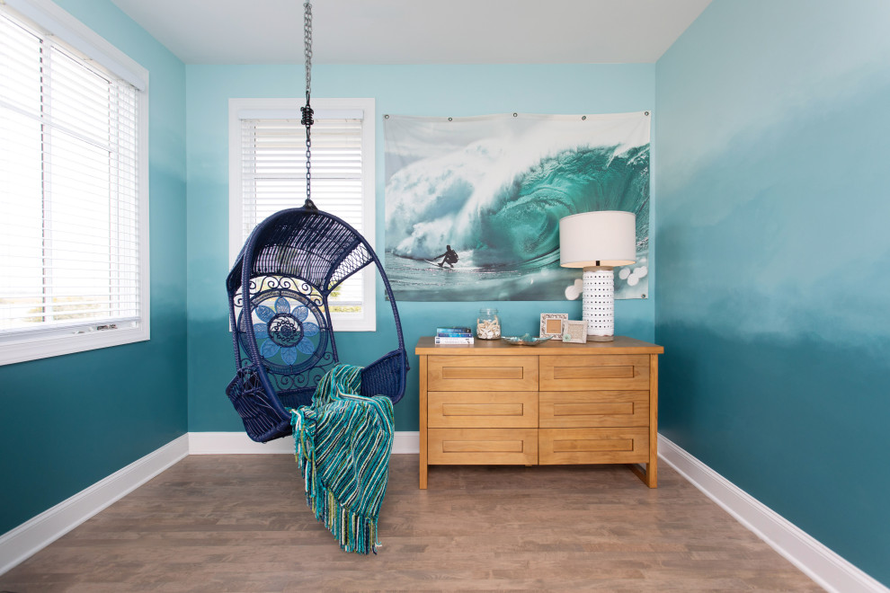 Photo of a mid-sized beach style bedroom in Other with blue walls.