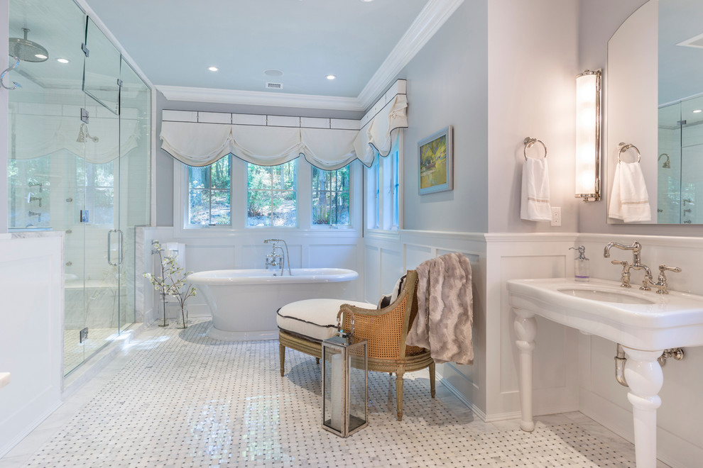 Inspiration for a traditional bathroom in New York with a console sink, a freestanding tub, an alcove shower, white tile, grey walls and mosaic tile floors.