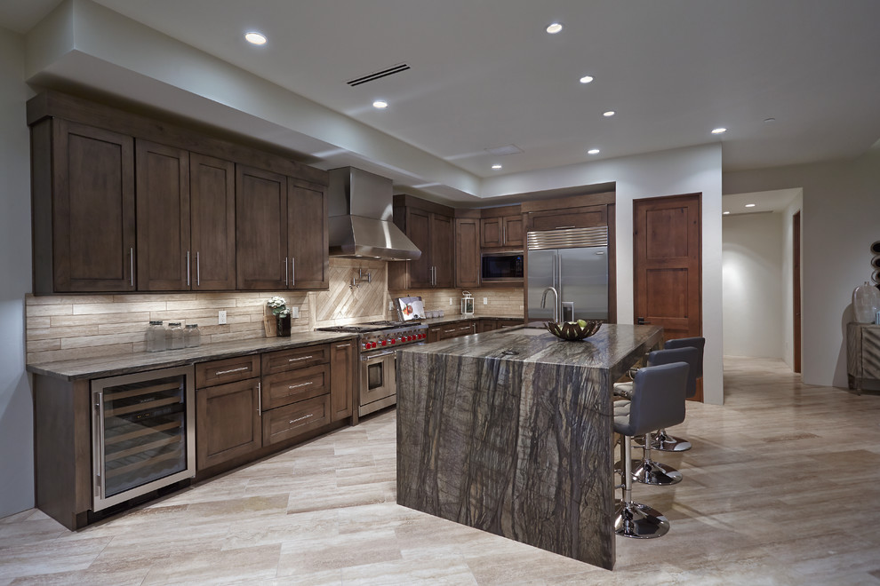 Design ideas for a mid-sized contemporary l-shaped open plan kitchen in Phoenix with an undermount sink, shaker cabinets, brown cabinets, quartzite benchtops, brown splashback, stone tile splashback, stainless steel appliances, travertine floors and with island.
