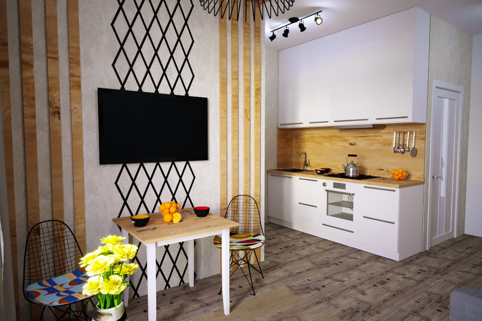 Белая кухня имеет 3 ряда шкафов в потолок