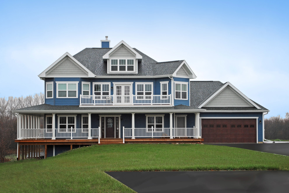 This is an example of a traditional three-storey blue house exterior in Other with a hip roof and a shingle roof.