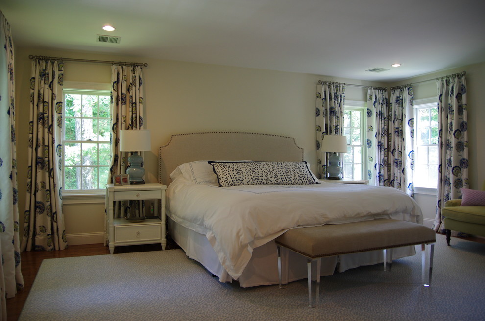 Design ideas for a large transitional master bedroom in Boston with beige walls, medium hardwood floors and brown floor.