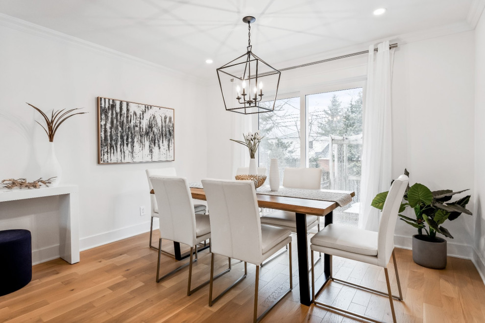 Mid-sized country light wood floor dining room photo in Montreal with white walls, a standard fireplace and a shiplap fireplace