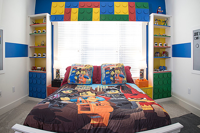 Example of a small trendy boy carpeted kids' room design in Los Angeles with white walls