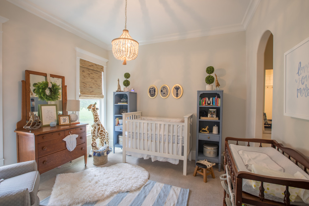 This is an example of a mid-sized traditional gender-neutral nursery in Houston with beige walls, carpet and beige floor.