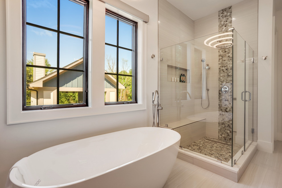 This is an example of a large transitional master bathroom in DC Metro with flat-panel cabinets, medium wood cabinets, a freestanding tub, a corner shower, white tile, a vessel sink, engineered quartz benchtops, a hinged shower door, a shower seat, a double vanity and a freestanding vanity.