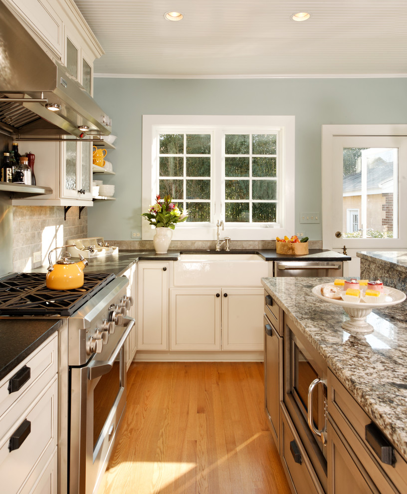 This is an example of a traditional kitchen in DC Metro with a farmhouse sink and stainless steel appliances.
