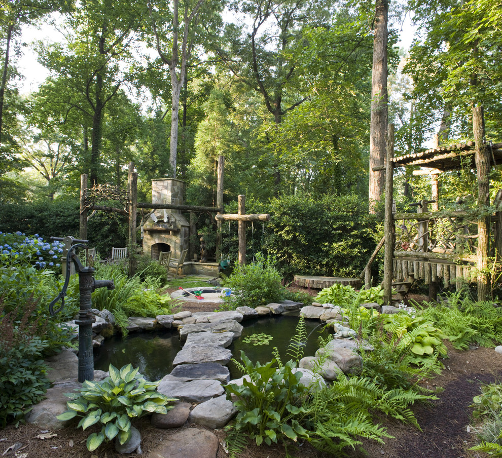 Photo of a country garden in Atlanta with with pond.