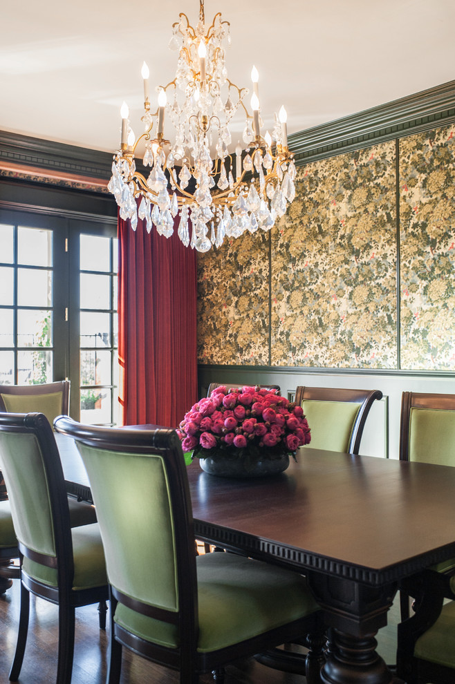 Photo of a traditional separate dining room in Los Angeles with green walls and dark hardwood floors.
