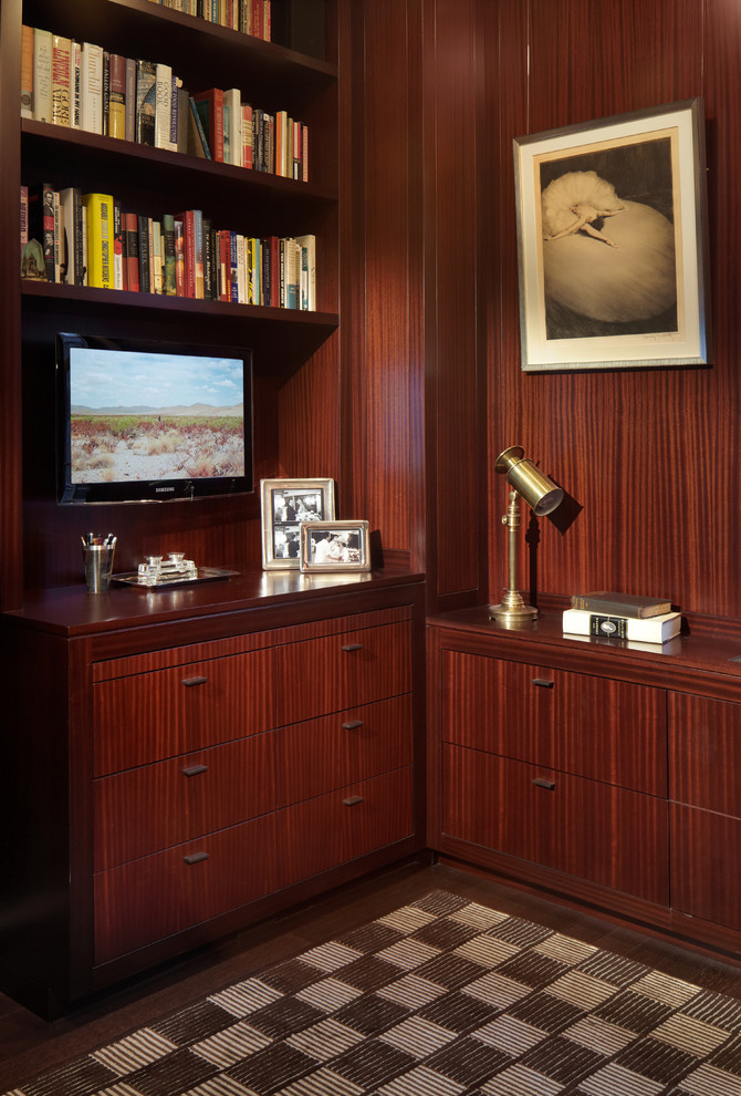 Mid-sized contemporary study room in New York with dark hardwood floors and a built-in desk.