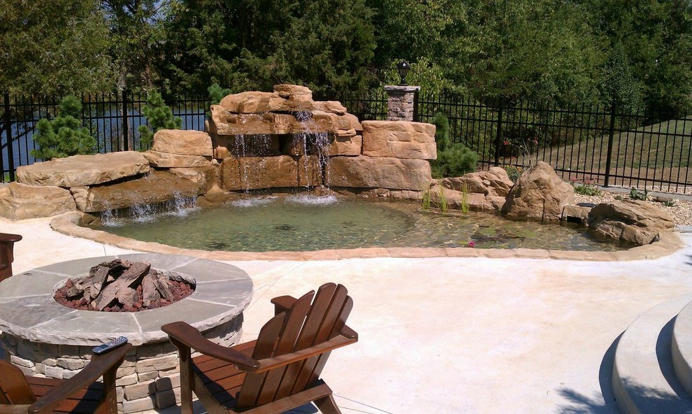 Large mountain style backyard stone and custom-shaped natural pool photo in Nashville