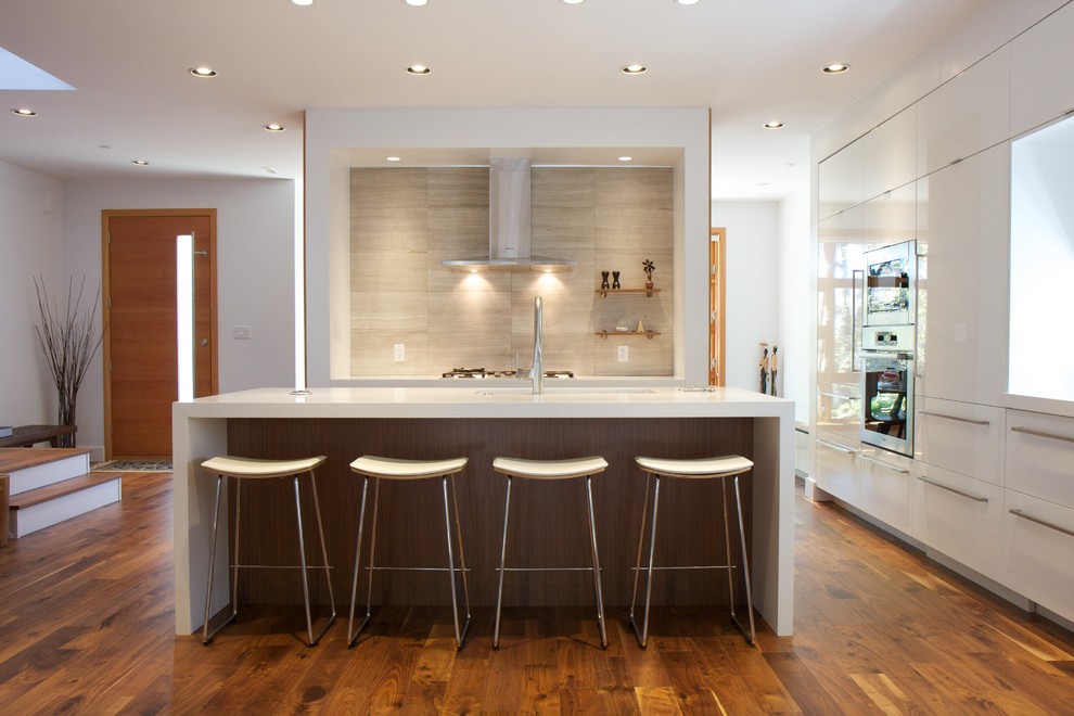 Design ideas for a contemporary l-shaped open plan kitchen in Vancouver.