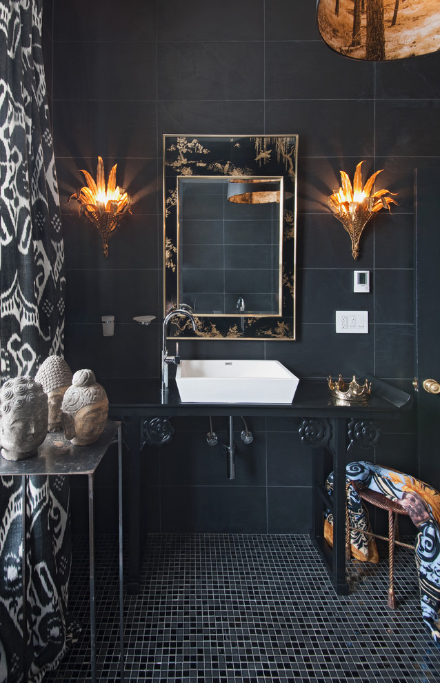 This is an example of an eclectic bathroom in Toronto with black cabinets, black tile, mosaic tile floors and a vessel sink.
