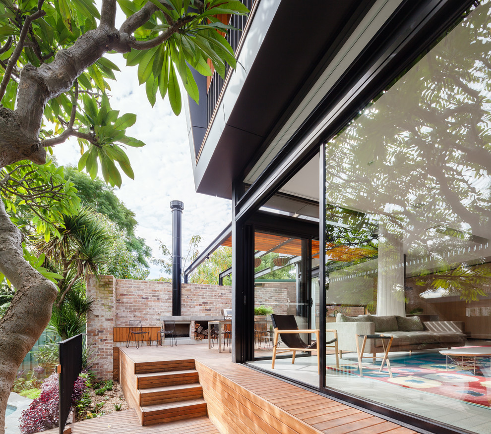 Small contemporary backyard deck in Sydney with a pergola.