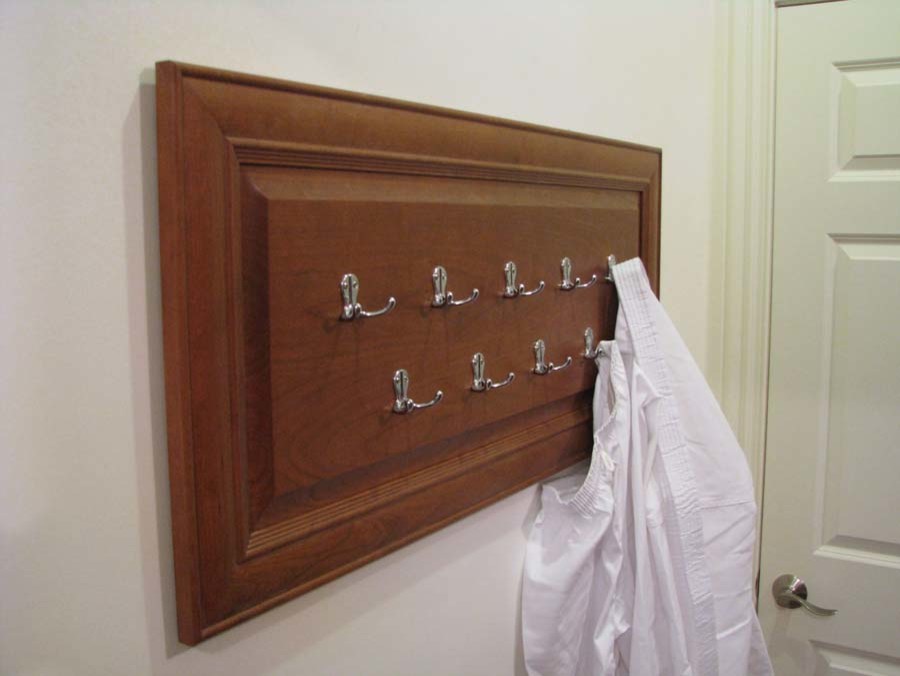 This is an example of a small traditional storage and wardrobe in New York with medium wood cabinets.