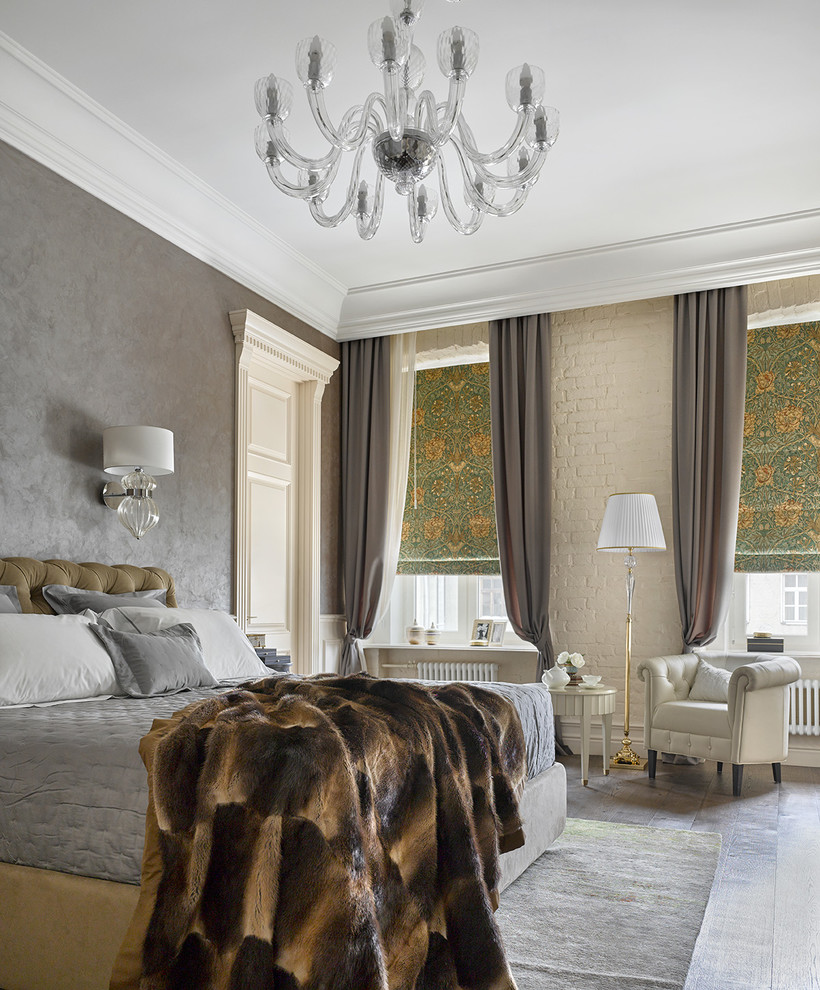 This is an example of a large transitional master bedroom in Moscow with grey walls and dark hardwood floors.