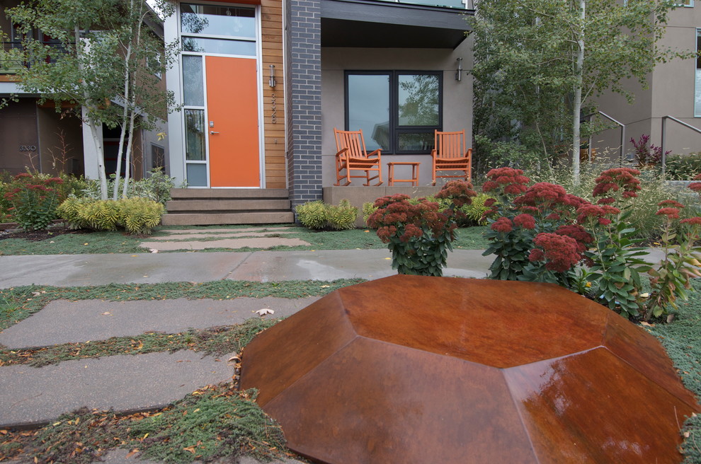 Inspiration for a small contemporary front yard xeriscape for fall in Denver with concrete pavers and a garden path.
