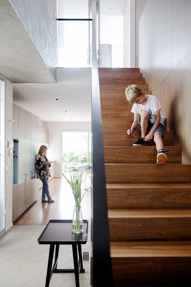 Mid-sized contemporary wood straight staircase in Sydney with wood risers.