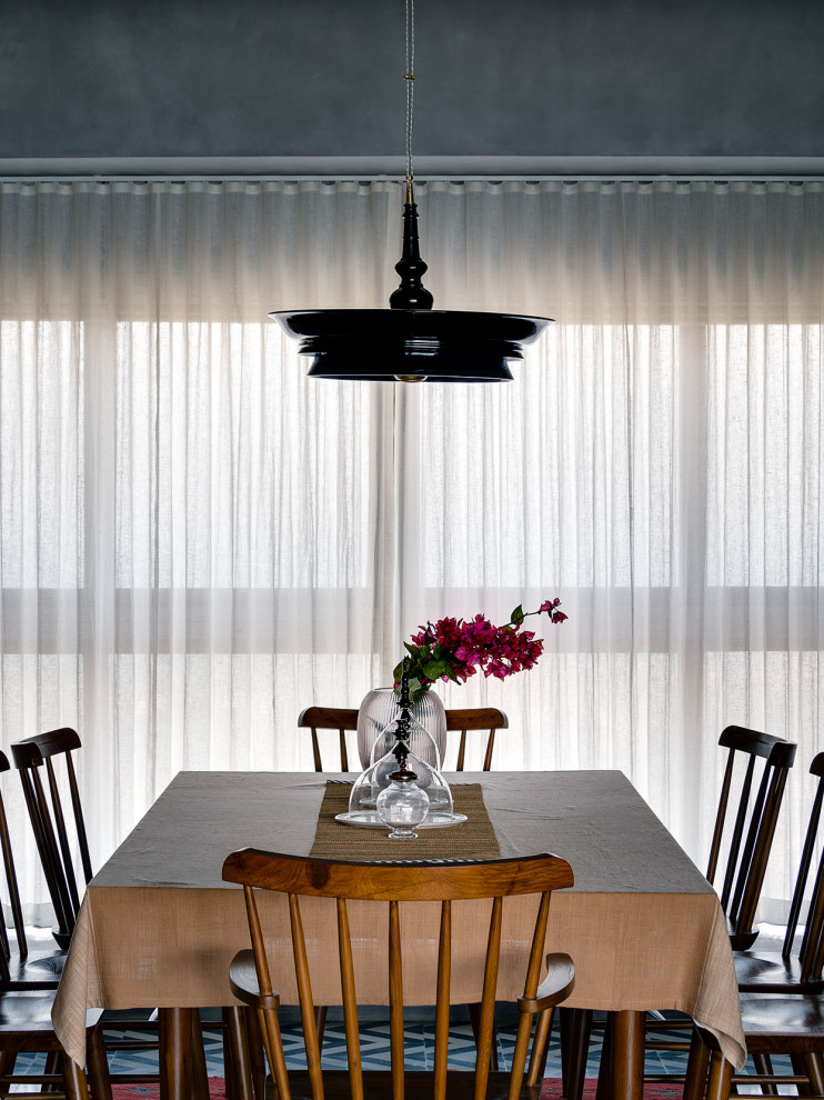 Design ideas for a contemporary dining room in Pune.