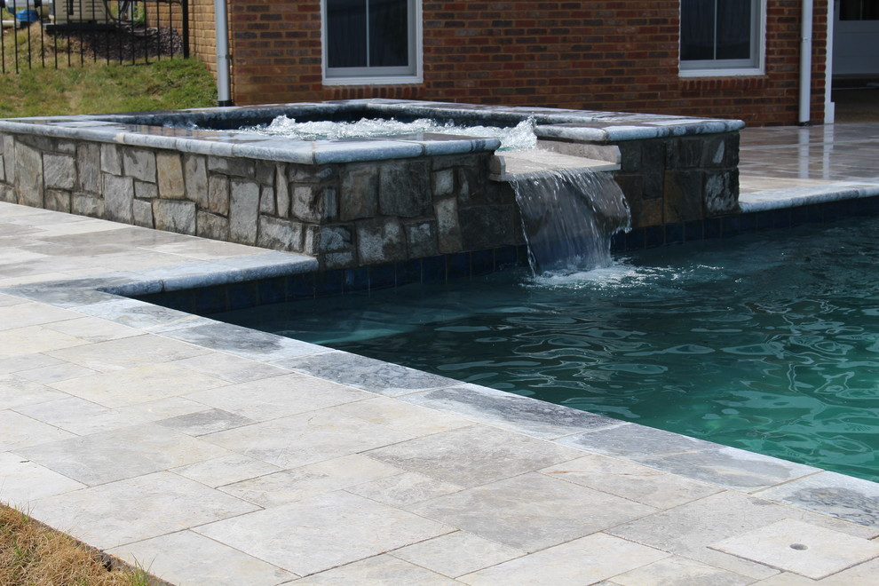 Inspiration for a small rustic backyard stone and rectangular natural hot tub remodel in DC Metro