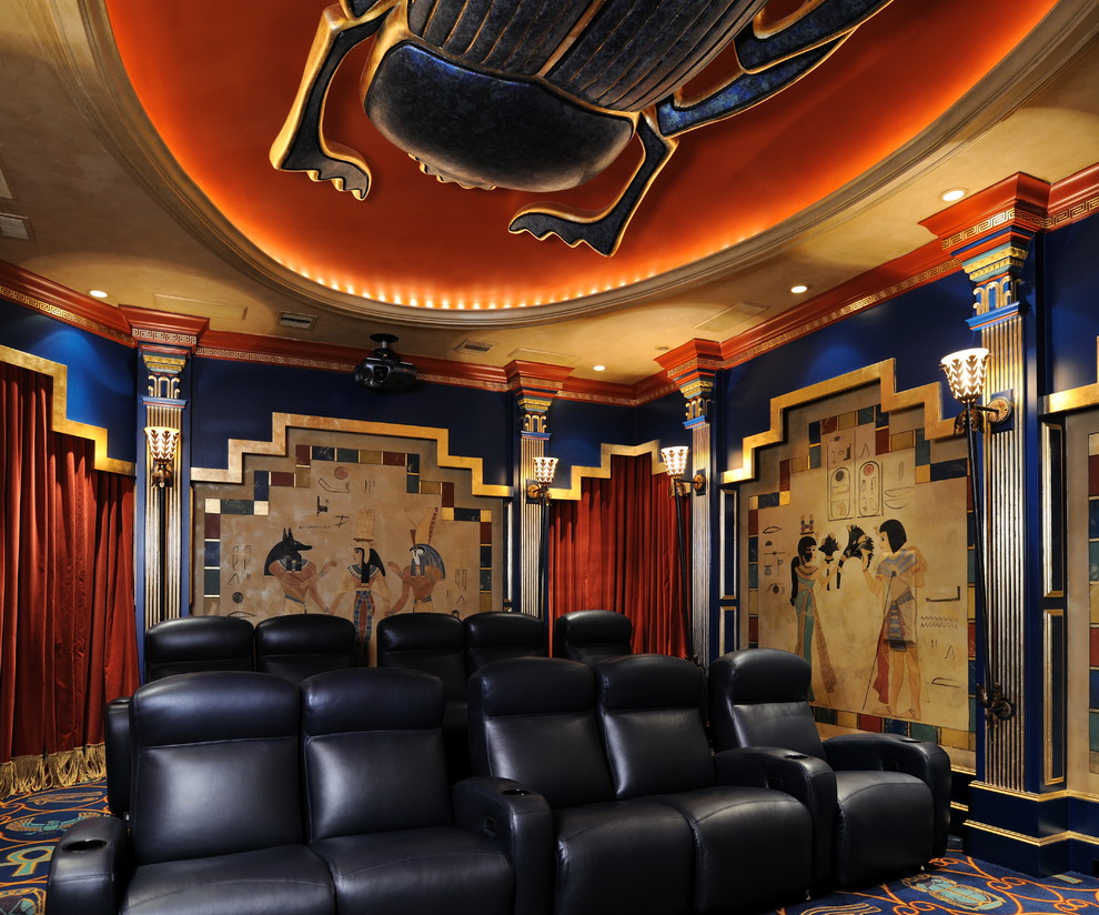 Large eclectic open concept home theatre in Houston with multi-coloured walls, carpet and a projector screen.