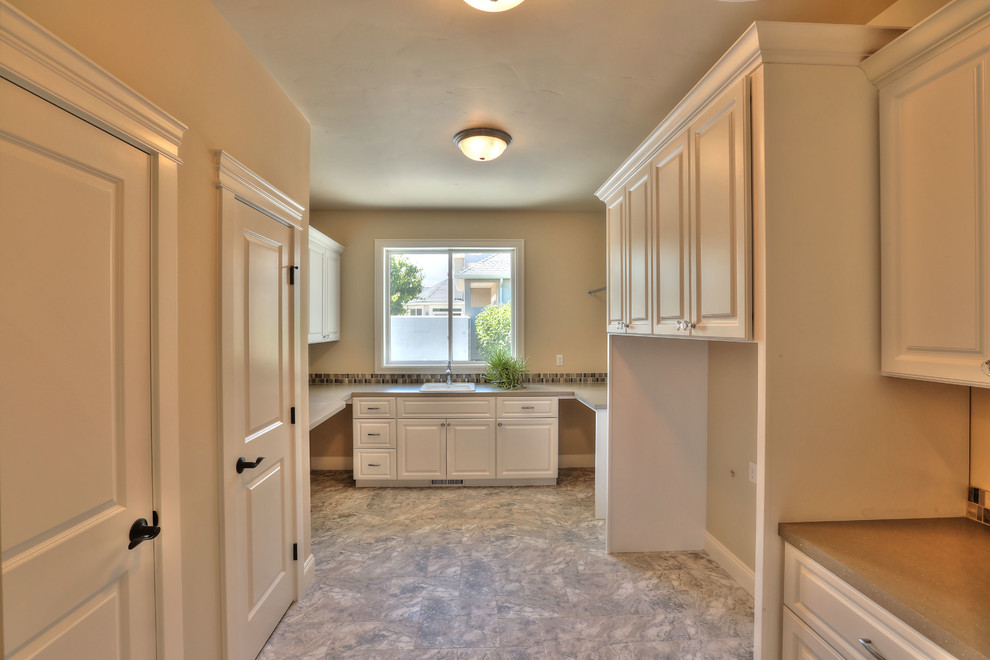 Transitional laundry room in Seattle.