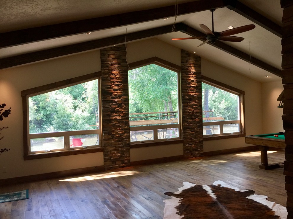 Example of a mountain style home design design in Albuquerque