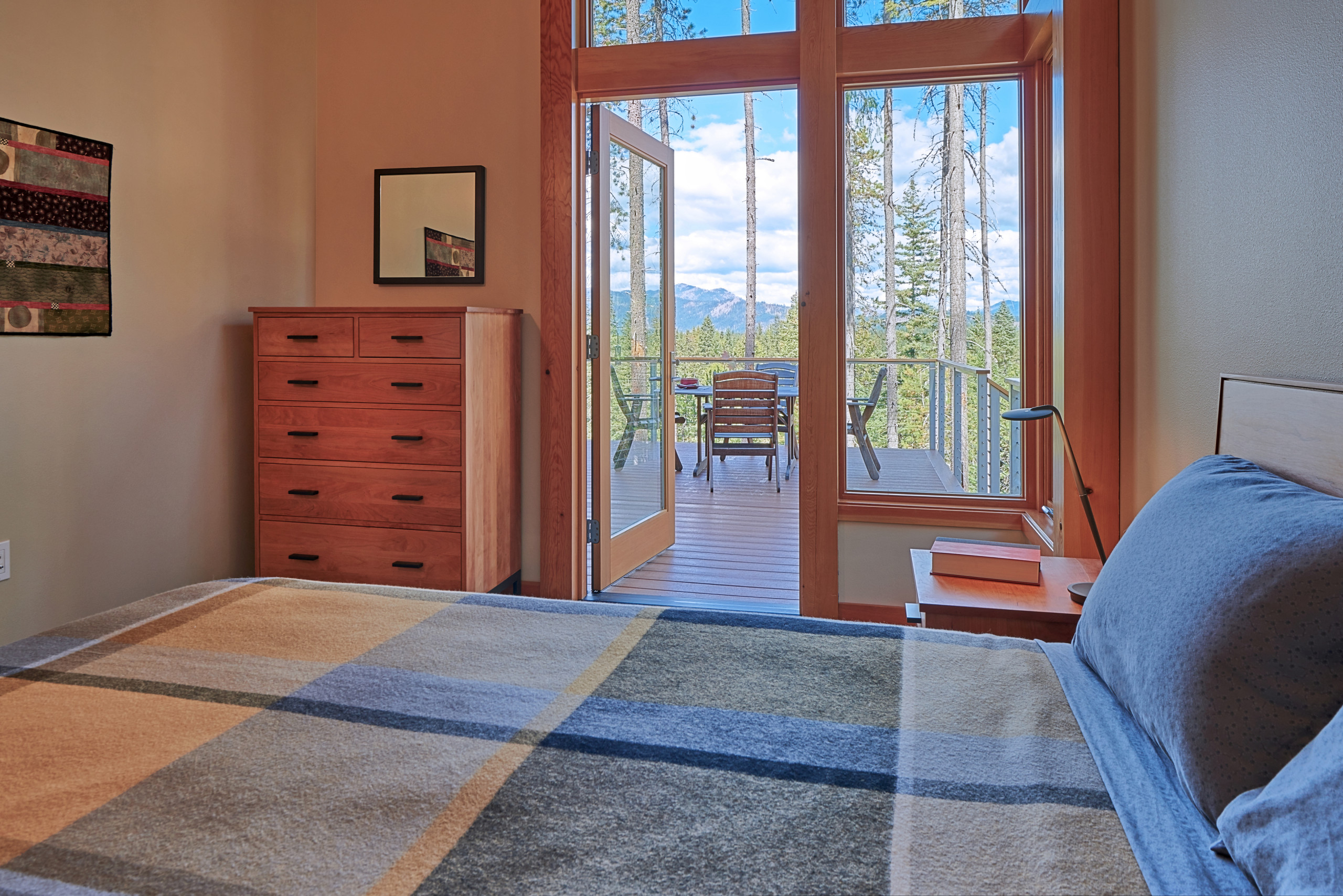 The second bedroom with exterior door leading to deck.